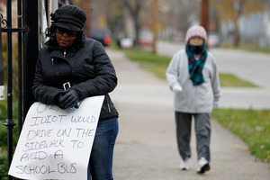 Shena Hardin holds up a sign to serve a highly public sentence. Photo / AP