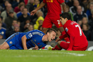 John Terry (left) scored for Chelsea but was later taken off after a collision with Liverpool's Luis Suarez. Photo / AP
