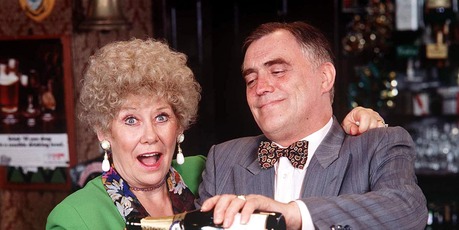 Vera Duckworth (Liz Dawn) and Jack Duckworth (Bill Tarmey) behind the bar in Rovers. Photo / Supplied
