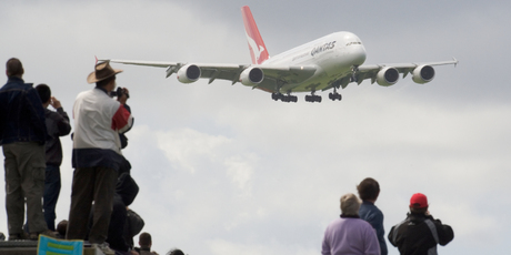 Qantas' Airbus A380 aircraft, watched by spectators at the Puhinui lookout, comes in to land at Auckland Airport, October 10, 2008. Photo / Paul Estcourt