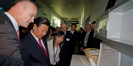 F&P's Stuart Broadhurst, left, shows Chinese Vice President Xi Jinping around their East Tamaki plant in 2010. Photo / NZPA