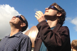Crowds gather outside the Auckland Observatory to view today's eclipse of the sun. Photo / Greg Bowker