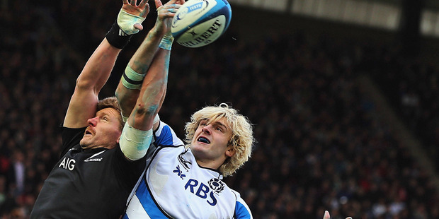 Adam Thompson of the All Blacks competes with Richie Gray of Scotland in the lineout. Photo / Getty Images