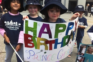 Capital City preschool four-year-olds Ishani, Lilly and Morgane welcome Prince Charles to Wellington.