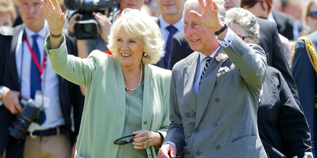 Prince Charles, Prince of Wales and Camilla, Duchess of Cornwall wave to the crowd at Manchester Square in Feilding. Photo / Getty Images