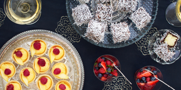 (From top) Chocolate lamingtons; fresh berry cups with Pimms and lime curd tarlets with mango and raspberries. Photo / Babiche Martens