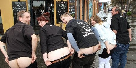Pier Side Cafe employees and New Brighton residents are busy practising for the Bare Your Bum for Brighton protest. Photo / Geoff Sloan