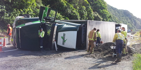 Emergency services staff attend a truck crash on State Highway 1. Photo / Daniel Pannett