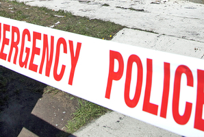 Tauranga police guard property after family barbeque is sparked by armed offenders. Photo / Ross Brown