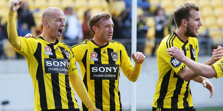 Phoenix players Stein Huysegems (l), Alex Smith (c) and Jeremy Brockie celebrate.