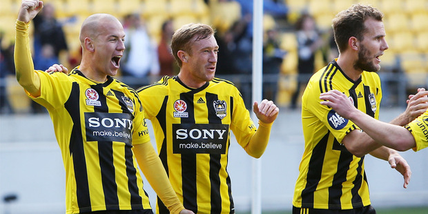 Phoenix players Stein Huysegems (l), Alex Smith (c) and Jeremy Brockie celebrate.