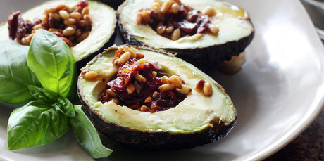 Pinenuts and sundried tomatoes add interest to avocados, served with Mediterranean dressing. Photo / Doug Sherring