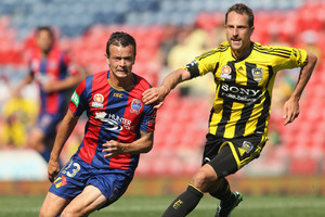 Ryan Griffiths of the Jets and Andrew Durante of the Phoenix during the round seven A-League match. Photo / Getty Images