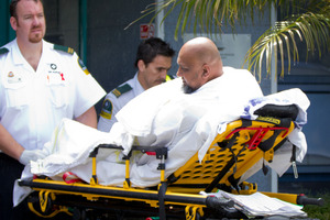 A survivor of the boating accident is transferred to an ambulance at the Marine Rescue Centre at Mechanics Bay. Photo / Sarah Ivey