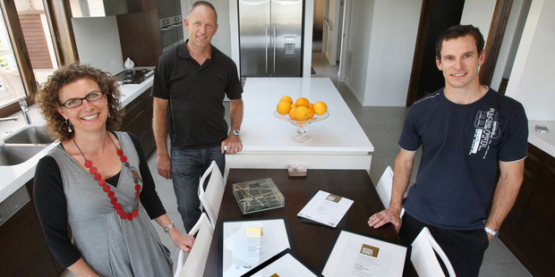 Riordan Construction's Paul Riordan (back), Helen Riordan and foreman Blair Littlejohn (right). Photo / Joel Ford