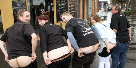Pier Side Cafe employees and New Brighton residents are busy practising for the Bare Your Bum for Brighton protest. Photo / Geoff Sloan
