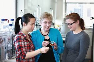 Professor Margaret Brimble (centre) says working with students like Tsz Ying Yuen (left) and Orla Finch is the reason she comes to work each day. Photo / Supplied
