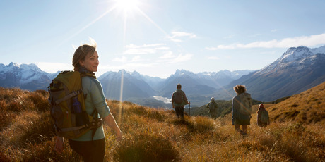 Tourism NZ advertisements appearing around the world make a clear connection with the Hobbit movies. Compare this image of tourists in New Zealand with the one below ... Photo / Supplied
