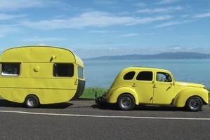 Sandra Hurley from Waihi Beach saw the yellow smart car towing the caravan in Sideswipe earlier this week and sent in a picture of her own canary combo. Photo / Supplied
