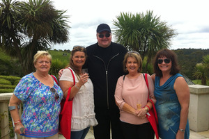 Kim Dotcom, centre, welcomed guests with bubbly. Photo / Supplied