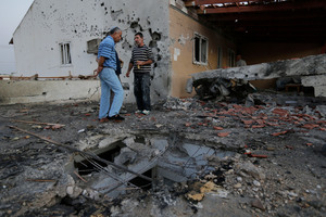 Two people were hurt when a rocket fired from Gaza hit the community of Ofakim in southern Israel. Photo / AP