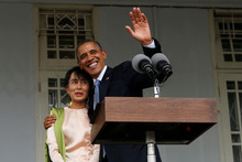 President Barack Obama waves as he embraces Myanmar opposition leader Aung San Suu Kyi. Photo / AP