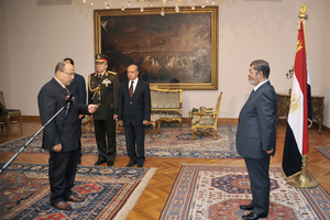 President Mohammed Morsi, right, swears in his new Prosecutor General, Talaat Abdullah. Photo / AP