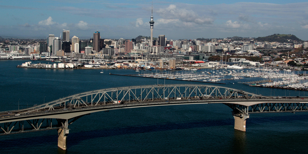 Painting Auckland's Harbour Bridge a colour other than grey could brighten motorists' days. Photo / NZ Herald