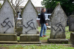 City Jewish graves were tagged with spray paint. Photo / Chris Gorman