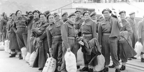 Soldiers on a wharf alongside Wahine ferry, on their embark to Korea. Photo / File