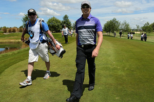 Clint Rice of Australia walks after a hole-in-one on the 9th hole during day three of the New Zealand Open Championship. Photo / Getty Images,