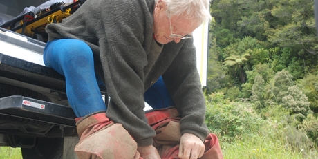 Exhausted caver Dereck Lipyeat, 82, of Christchurch, rests his weary bones on the step of an ambulance after being rescued from a limestone cave near Punakaiki this afternoon. Photo / Greymouth Star