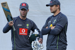 Michael Clarke talks to Shane Watson during an Australian training session. Photo / Getty Images