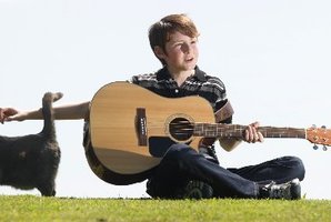 Fletcher Oxford pictured with his new cat Zoe after his wild cat and inspiration Sushi went bush.
