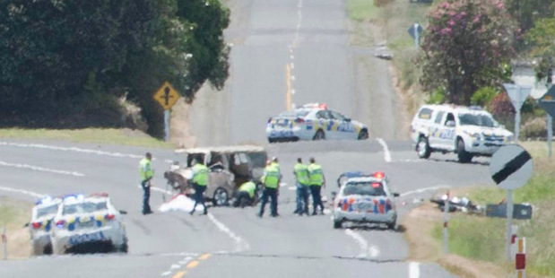 Through a heat haze, the horrific scene of a fatal crash in Taranaki, in which a van ploughed head-on into a group of motorcyclists on a charity toy run. Photo / Kevin Bone