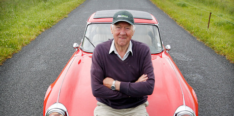 John Sansome and his red E-type Jaguar. Photo / Christine Cornege