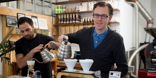 Mike Murphy (right), with barista Sam Jarvis, says the new shareholder would ideally offer guidance on growth strategy. Photo / Greg Bowker