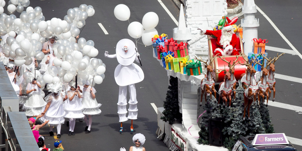 Excitement as the annual Santa Parade wends its way through downtown Auckland, with the star of the show prominent in his decorated sleigh. Photo / Natalie Slade