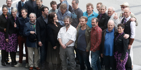 Sir Peter Jackson and The Hobbit cast pose with Air NZ staff during their photo call at Wellington International Airport today. Photo / Mark Mitchell