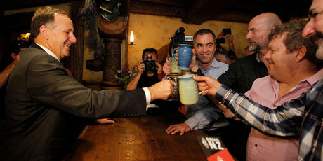 John Key shared a beer yesterday at Hobbiton's Green Dragon Pub in Matamata with actors (from right) William Kircher, Stephen Hunter, Graham McTavish and James Nisbet. Photo / Christine Cornege