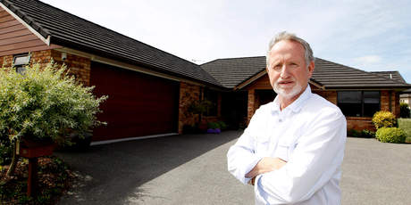David Lugton shows a house in Huntington that could not have been built if the proposed rules had already been in force. Photo / Christine Cornege