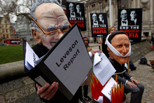 Protesters outside the building where the Leveson report was released reinforced the public outrage over the abuses and power of the press, especially in the Murdoch media empire. Photo / AP