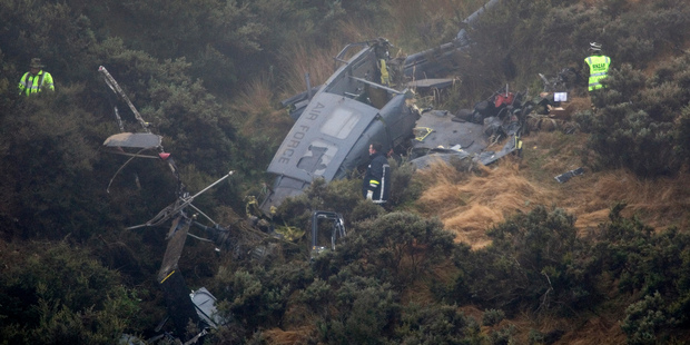 Three men died and one was seriously injured when the RNZAF Iroquois helicopter crashed near Pukerua Bay. Photo / Mark Mitchell
