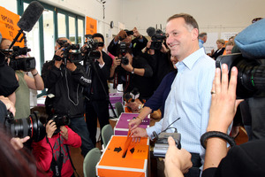 John Key votes in the Parnell District School on the day of the New Zealand General Election 2011. Photo / Janna Dixon