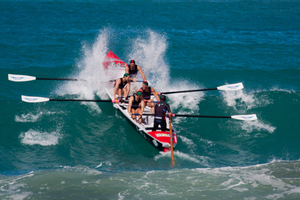 The champion Piha men's boat crew on their way to the national title at Midway Beach, Gisborne. Photo by Jamie Troughton/Dscribe Journalism.