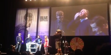 Prime Minister john Key eats bugs on stage with Bear Grylls during Grylls' one man show in Auckland. Photo / YouTube