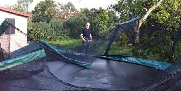 Paul Dunn with his damaged trampoline. Photo / Paul Harper