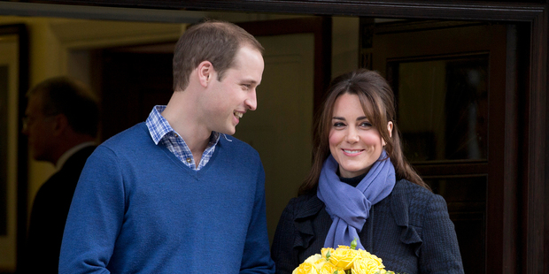Britain's Prince William stands next to his wife Kate, Duchess of Cambridge, as she leaves the King Edward VII hospital in central London. Photo / AP