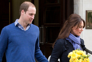 Britain's Prince William stand next to his wife Kate, Duchess of Cambridge as she leaves the King Edward VII hospital in central London. Photo / AP