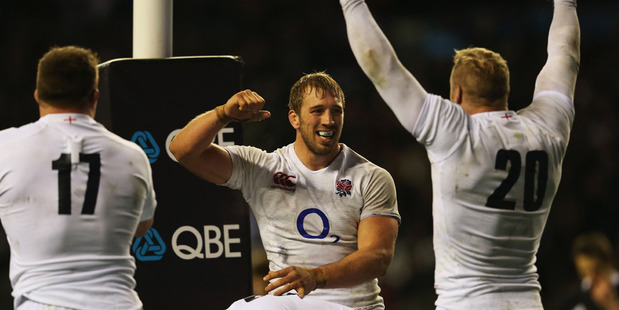 Captain Chris Robshaw of England celebrates with team mates after beating the All Blacks 38-21 during the QBE International match between England and New Zealand. Photo / Getty Images.